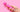 Woman with vibrator from sex shop on pink background